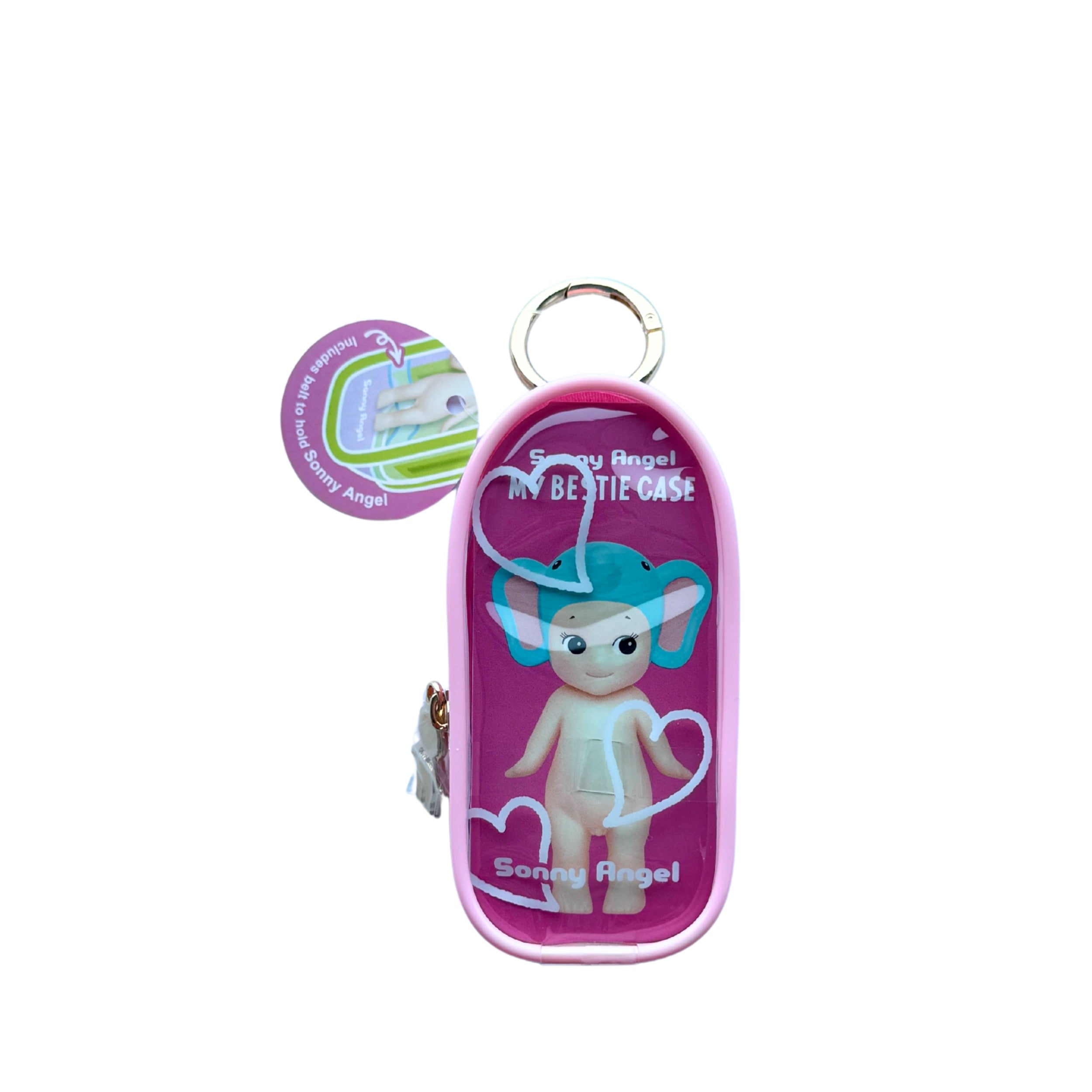 A pink and purple 'Sonny Angel' baby diaper case with a clear front window showing a small angel figurine inside, attached to a silver key ring. A circular product information sticker is visible on the left side, all set against a plain white background.